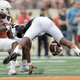 Texas quarterback Tyrone Swoopes gets sacked by Texas defensive end Quincy Vasser in the spring game. Via AP.